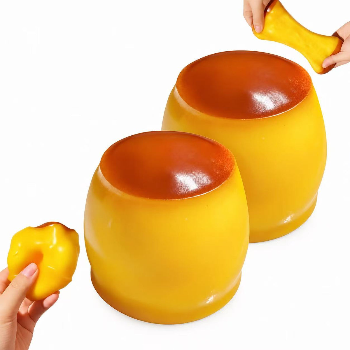 Two large Pudding Squishy Balls with hands demonstrating stretching and squeezing