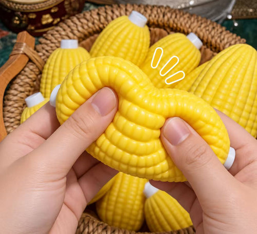 Hands squeezing a yellow corn squishy toy