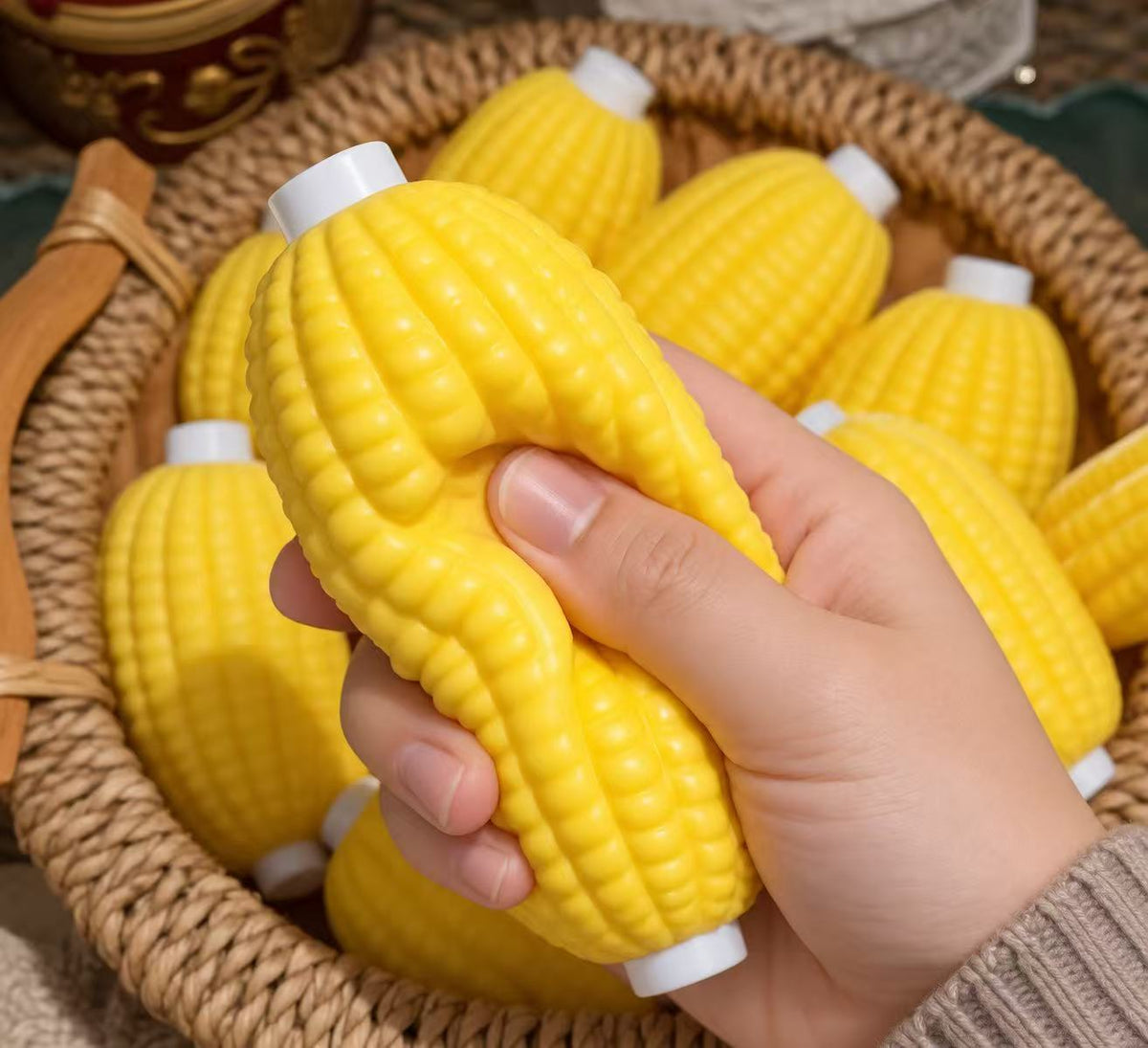 Child holding a corn squishy toy