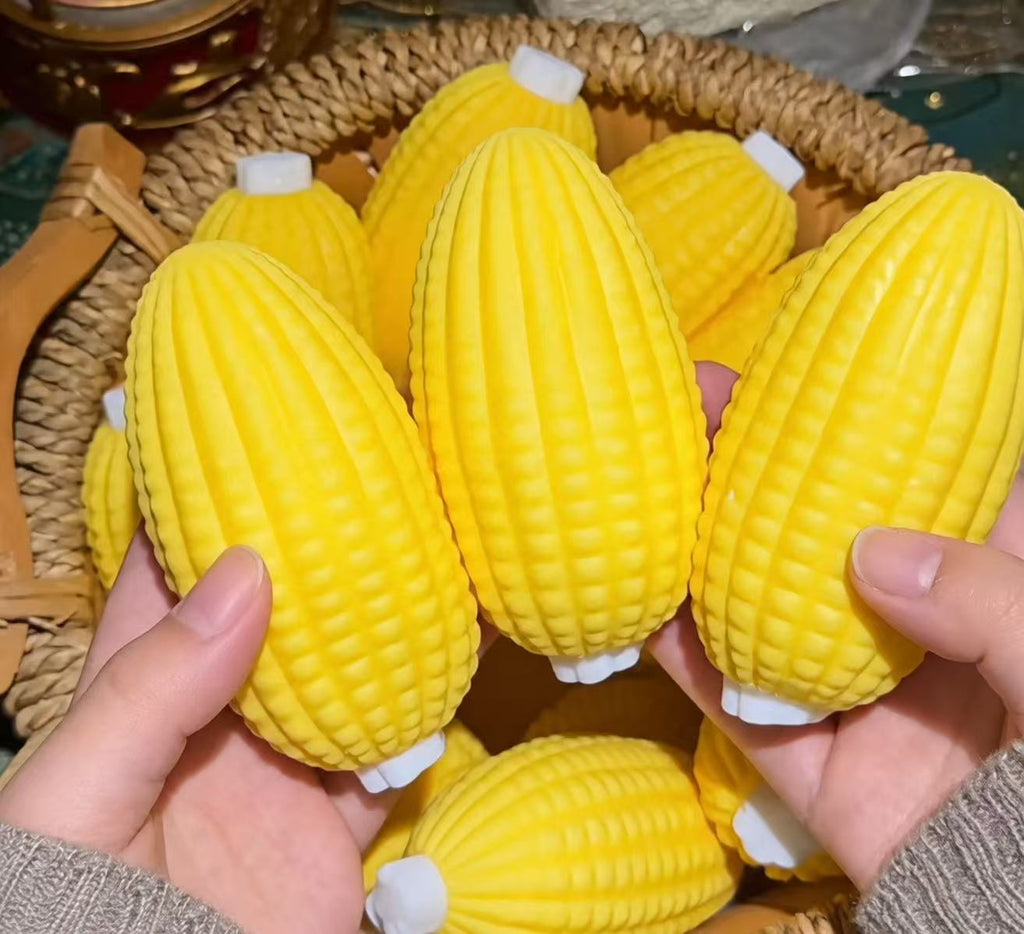 Multiple corn squishy toys in a basket