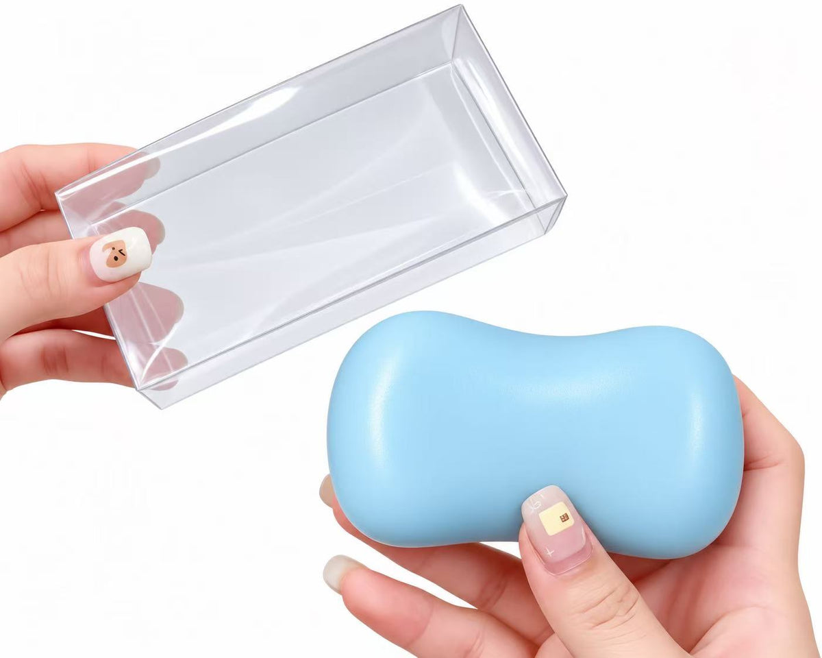 Bean Squishy Stress Ball in white held in palm