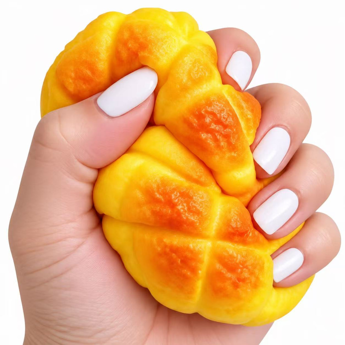 Mango Squishy being squeezed in hand showing realistic texture
