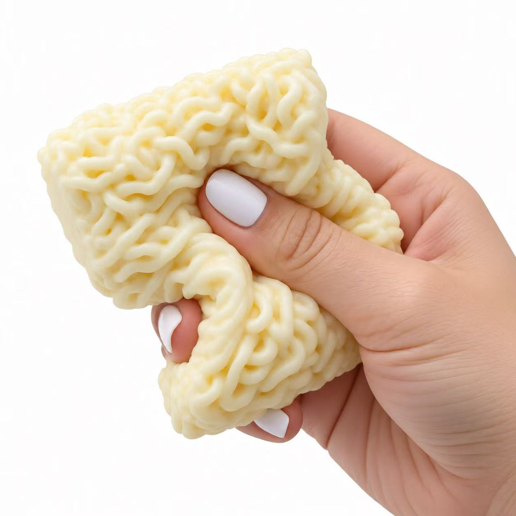 Noodle Squishy being squeezed in hand showing soft squishy texture