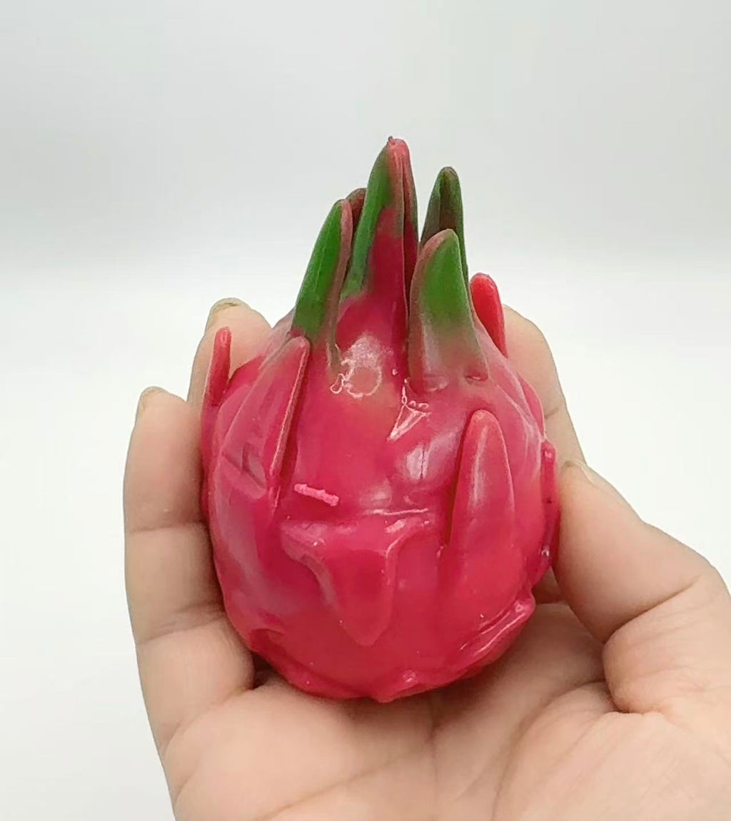 Dragon Fruit Squishy resting in open palm - showing full size